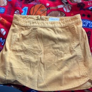 This is a mustard yellow, corduroy mini skirt from pacsun, never worn.